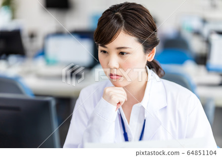 Woman in medical facility Woman in medical facility 64851104