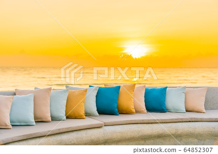 Comfortable pillow on sofa chair around outdoor patio with sea ocean beach view 64852307