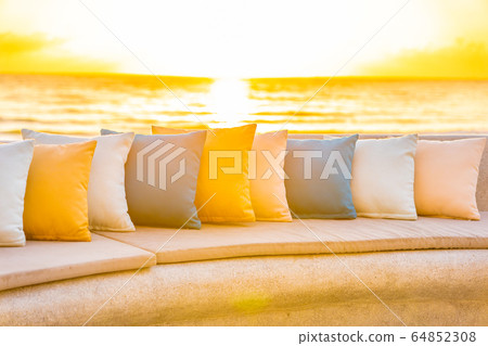 Comfortable pillow on sofa chair around outdoor patio with sea ocean beach view 64852308
