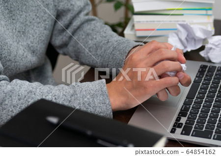 A man working on a PC 64854162