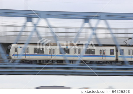 New Subway Tozai Line Series 05 crossing Arakawa Bridge (follow shot) 64856268