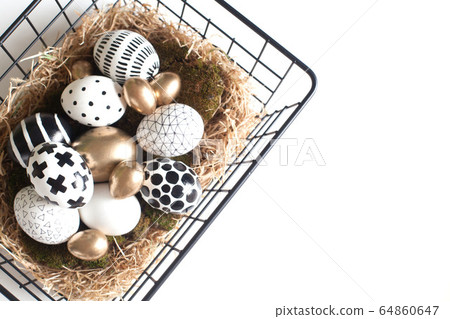 Top view of an iron mesh basket with a nest. Nordic style 64860647