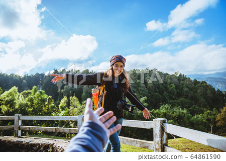 couple asians travel nature in the holiday. Hold hands running happy enjoy nature on the mountain 64861590