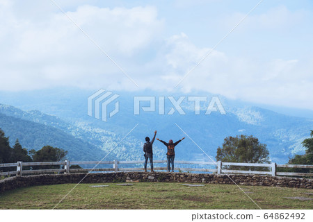 Couples travel nature at sheep farm at Doi Pha Tang, Doi Inthanon National Park Couples travel nature at sheep farm at Doi Pha Tang, Doi Inthanon National Park 64862492