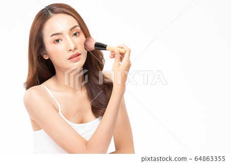 Beauty asian woman brown hair looking smile in camera happiness and hold make up brush and cheerful with make up brush,Beauty Concept on white background. Beauty asian woman brown hair looking smile in camera happiness and hold make up brush and cheerful with make up brush,Beauty Concept on white background. 64863355
