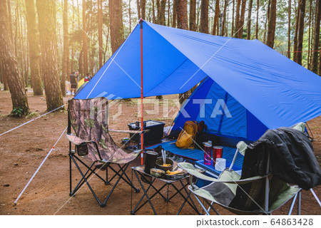 camping tent, Nature tourism, camping in the middle of the pine forest. camping tent, Nature tourism, camping in the middle of the pine forest. 64863428