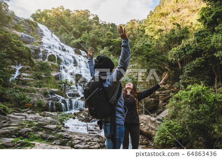 Travel relax to visit the waterfalls of couples at the waterfall mae ya chiangmai in thailand. Travel relax to visit the waterfalls of couples at the waterfall mae ya chiangmai in thailand. 64863436