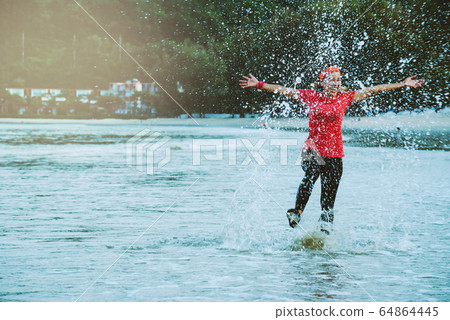 asian woman jogging workout on the beach in the morning. Relax with the beach. asian woman jogging workout on the beach in the morning. Relax with the beach. 64864445