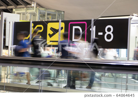 a unidentified blurred passengers at the airport. a unidentified blurred passengers at the airport. 64864645