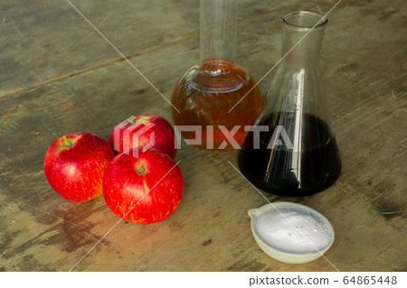 Agriculture chemical in fruits. Close up of apples Agriculture chemical in fruits. Close up of apples 64865448