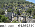 Ghost Town, Abandoned houses and ruins of Kayakoy village, Fethiye, Turkey 64865830