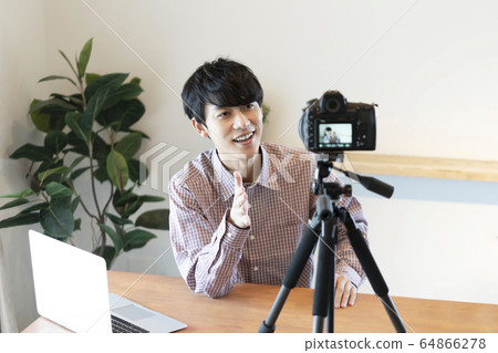 Young men shooting video 64866278