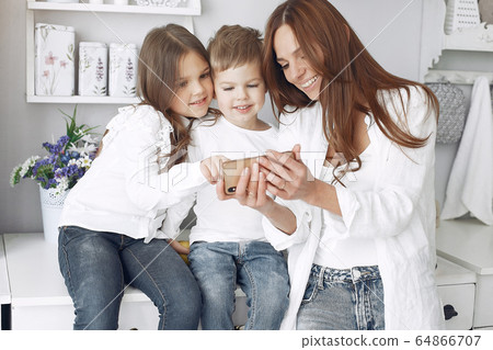 Mother with little children having fun at home Mother with little children having fun at home 64866707