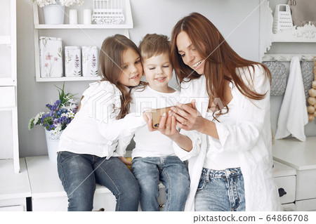 Mother with little children having fun at home Mother with little children having fun at home 64866708