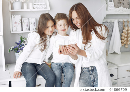 Mother with little children having fun at home Mother with little children having fun at home 64866709