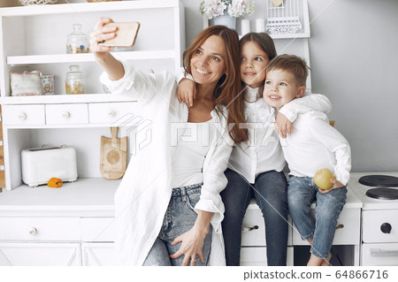 Mother with little children having fun at home Mother with little children having fun at home 64866716