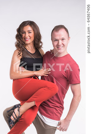Beauty couple dancing social dance. Kizomba or bachata or semba or taraxia , on white background. Social dance concept. 64867406