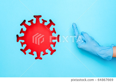 Hand in medical glove showing middle finger and 64867669