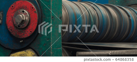 Metal rolls of roll forming machine at a metalwork Metal rolls of roll forming machine at a metalwork 64868358