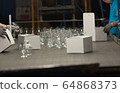 Close-up view of the hands of a manufacturing 64868373