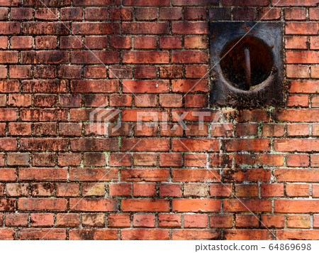 Red brick wall and mooring ring (Osaka Kuma Gate) 64869698