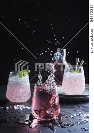 Splash of a pink cocktail 64870318