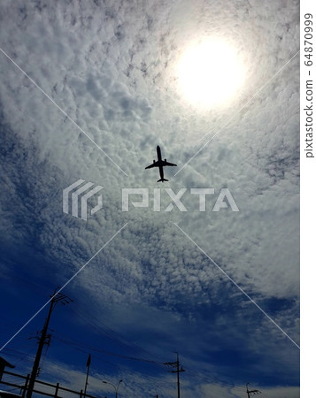 Sun, clouds, and airplane Sun, clouds, and airplane 64870999