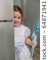 little girl with soap bubbles at home 64871941
