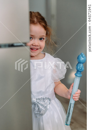 little girl with soap bubbles at home 64871941