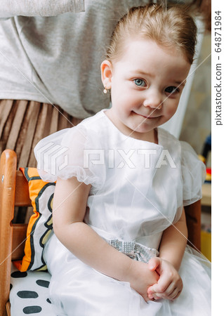 Happy loving family. Mother combs her daughter's hair 64871984