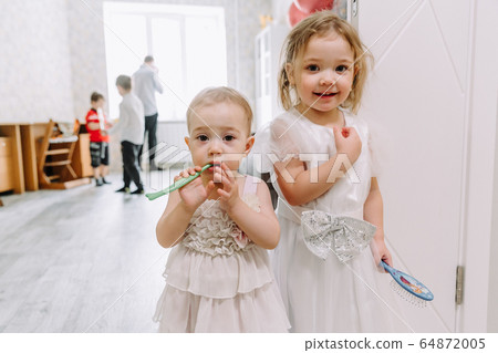 two little girls at a children's birthday party 64872005