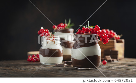 dessert with white and dark chocolate cream dessert with white and dark chocolate cream 64872081