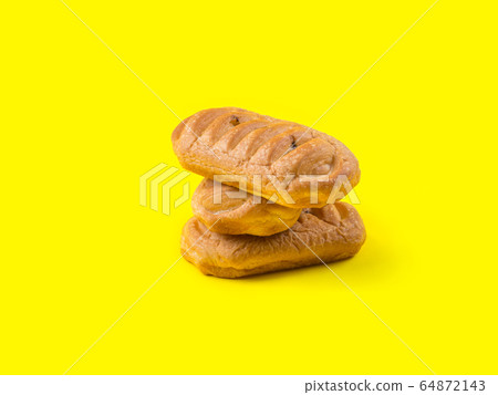 Bakery sweet pastry stack on yellow background 64872143
