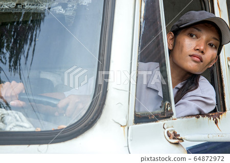 woman truck driver in the car 64872972