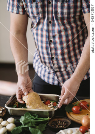 Man cooking healthy fat- free, no fry meals Man cooking healthy fat- free, no fry meals 64873097