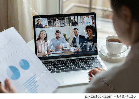 Diverse businesspeople talk on video call on laptop 64874120