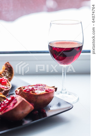 Pomegranate juice and fruits. Fruit , vitamins and food concept. Pomegranate juice and fruits. Fruit , vitamins and food concept. 64874764