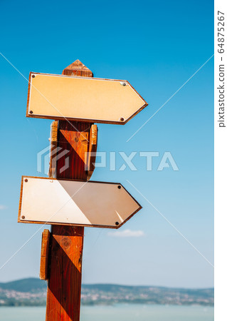 Arrow direction sign with Lake Balaton in Tihany, Hungary Arrow direction sign with Lake Balaton in Tihany, Hungary 64875267