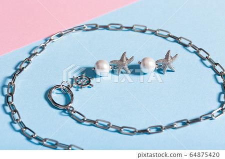 Perfect accessories. Trendy jewelry set. Fashion jewelry and bijouterie. Top view. Perfect accessories. Trendy jewelry set. Fashion jewelry and bijouterie. Top view. 64875420