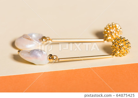 Top view of fashion jewelry and accessories on bright color background. Luxurious jewelry bijouterie and trendy concept. 64875425