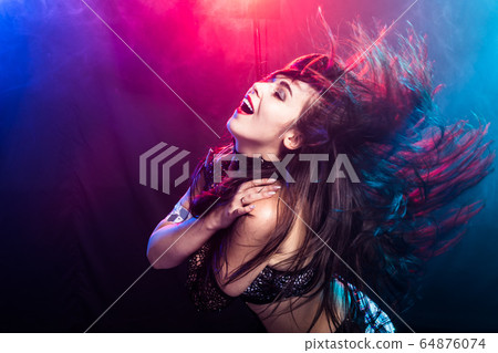 Spirituality dance. Beautiful sexy woman with luxury glossy eastern make-up dancing tribal fusion. Belly dance. 64876074