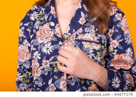 Close-up detail and fabric texture of a pajama. Home wear, sleepwear, shopping and sale concept. 64877179