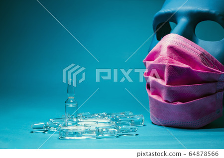 Medical pink mask put on a blue mask 64878566