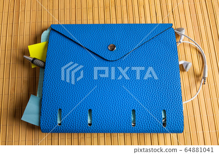 notebook with earphones 64881041