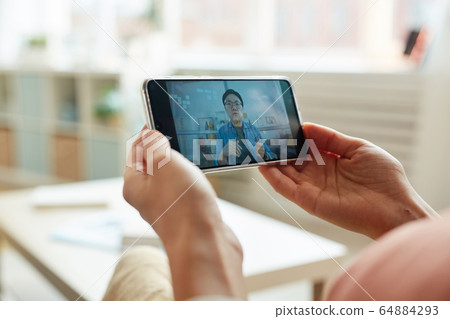 Hands Holding Smartphone 64884293