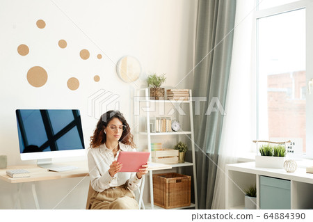 Remote Worker Using Tablet PC Remote Worker Using Tablet PC 64884390