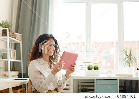 Woman Having Online Meeting 64884401
