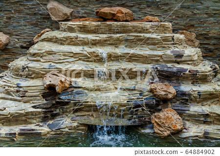 A beautiful waterfall in the park A beautiful waterfall in the park 64884902