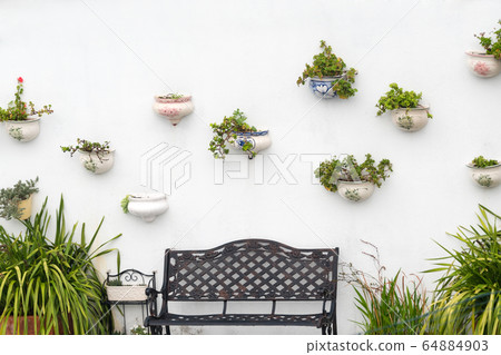 Typical white village with flower pots on facades Typical white village with flower pots on facades 64884903