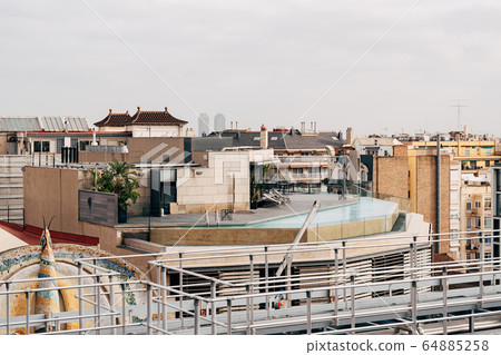 Rooftop pool. View from a nearby building onto the roof of the house on which the pool is located. 64885258